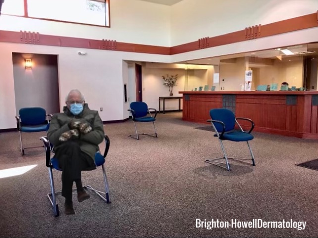 A Person Sitting in the Waiting Area with Masks and Mittens