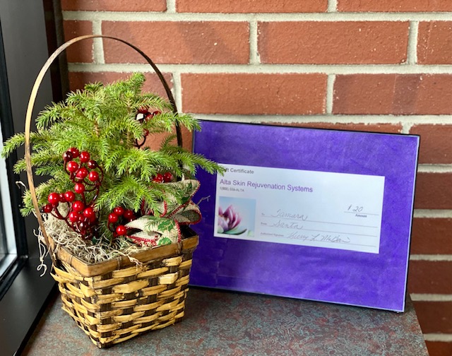 A gift certificate beside a Christmas decor