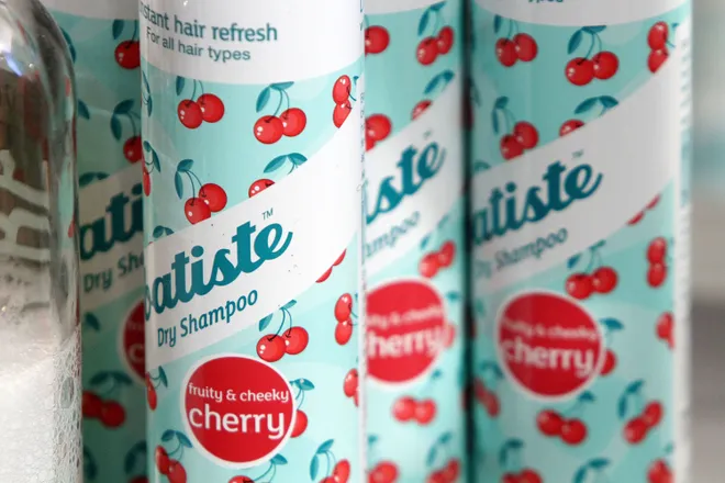 Several cans of Batiste cherry dry shampoo